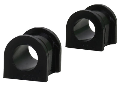 Two black rubber sway bar bushings on a white background