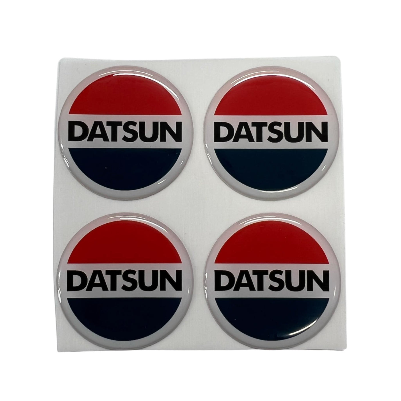 Datsun emblem / stickers for hub caps, horn button,gear shift set of (4)